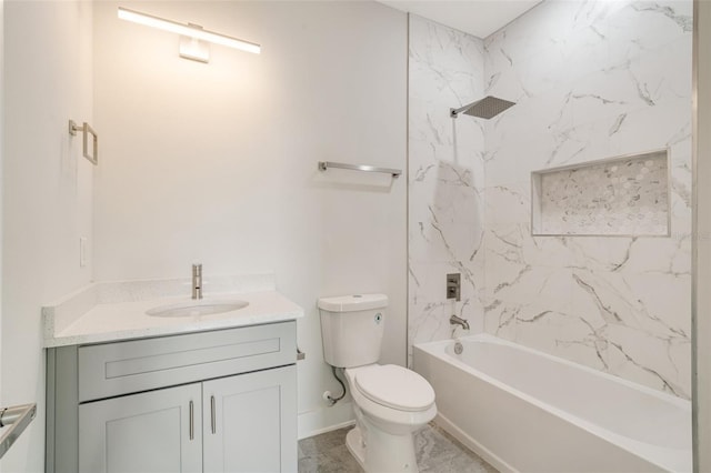 full bathroom featuring tiled shower / bath combo, vanity, and toilet