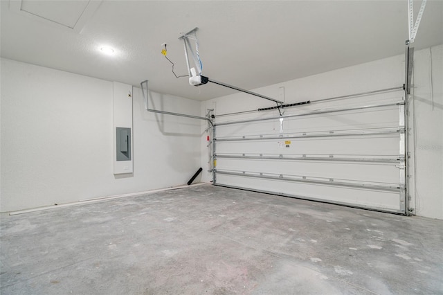 garage featuring a garage door opener and electric panel