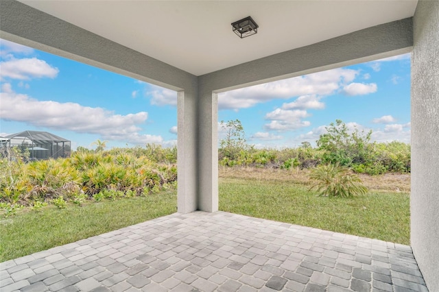 view of patio / terrace with a lanai