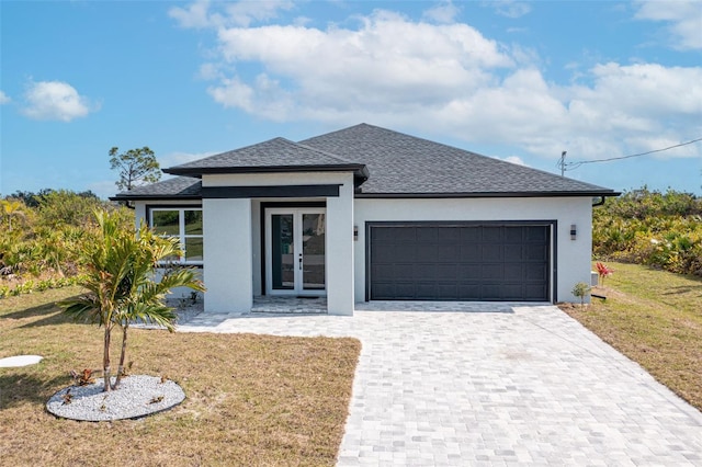 view of front of home with french doors and a front yard