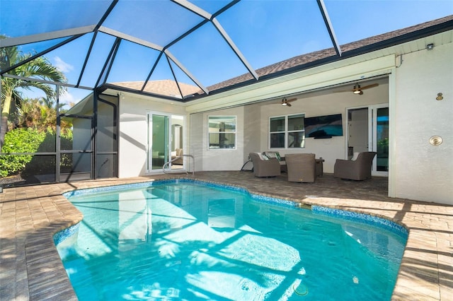 view of pool featuring ceiling fan, a lanai, an outdoor hangout area, and a patio area