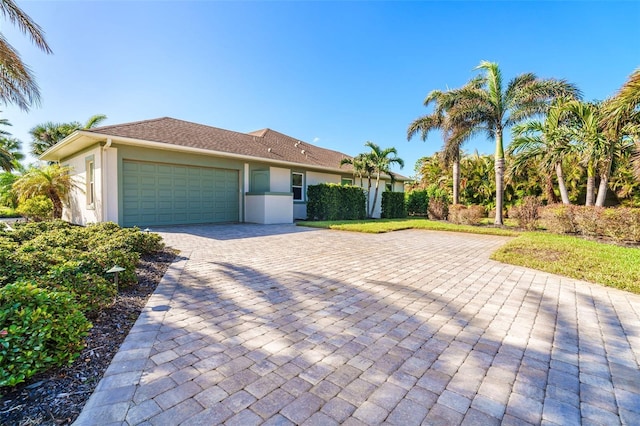 single story home with a garage