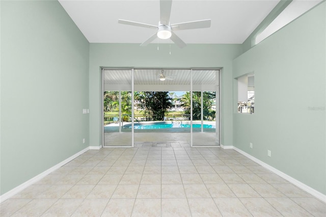 tiled empty room with ceiling fan