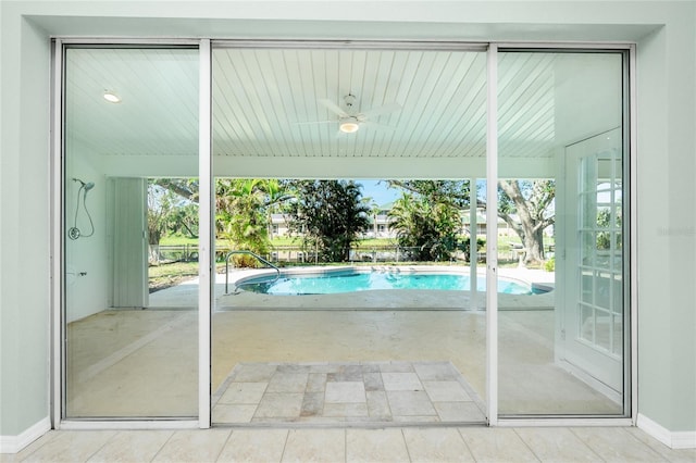 view of swimming pool featuring a patio area and ceiling fan