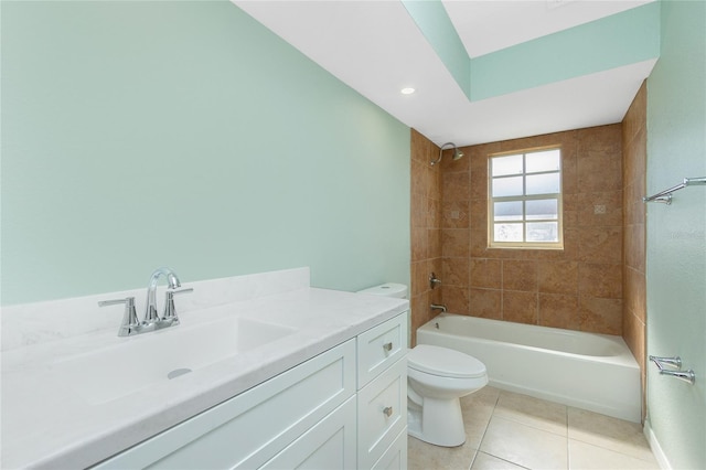 full bathroom with tile patterned flooring, vanity, toilet, and tiled shower / bath