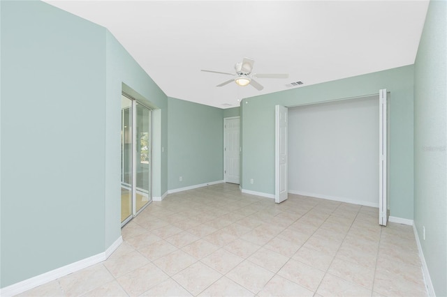 unfurnished room with ceiling fan