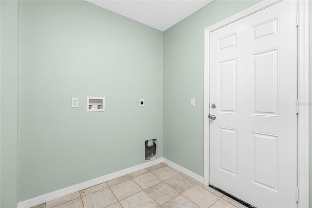 washroom with hookup for an electric dryer, light tile patterned floors, and hookup for a washing machine