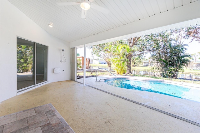 view of swimming pool with ceiling fan and a patio