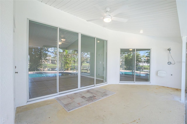 interior space featuring ceiling fan and a patio