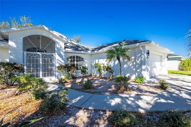 view of front of property with french doors and a garage