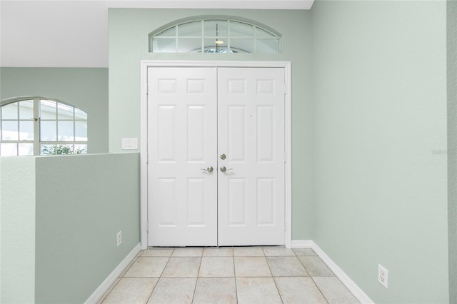 entrance foyer featuring light tile patterned floors