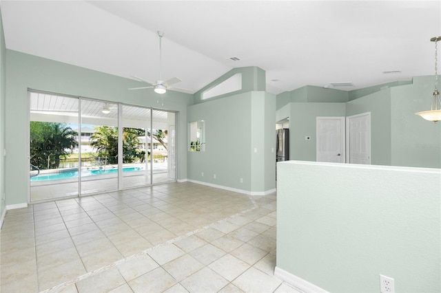 217 Rotonda Cir, Rotonda West, FL 33947 - spare room featuring ceiling fan, light tile patterned flooring, and vaulted ceiling