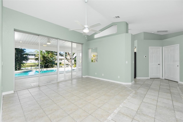 217 Rotonda Cir, Rotonda West, FL 33947 - empty room with ceiling fan, tile patterned flooring, and vaulted ceiling