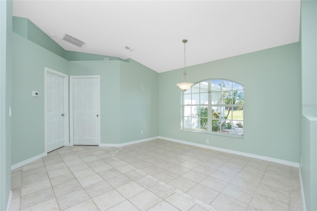 217 Rotonda Cir, Rotonda West, FL 33947 - spare room with light tile patterned floors and lofted ceiling