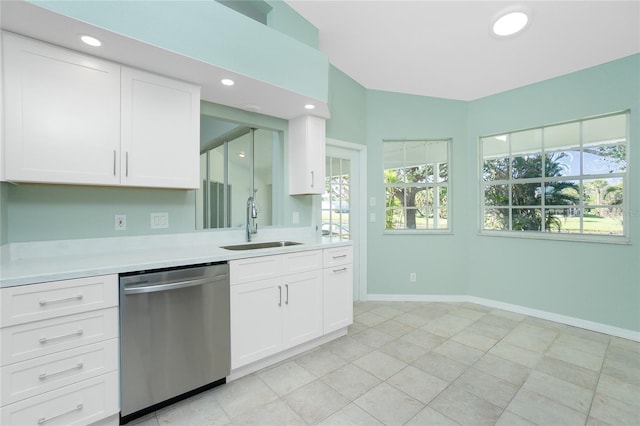 217 Rotonda Cir, Rotonda West, FL 33947 - kitchen with dishwasher, light countertops, white cabinetry, recessed lighting, and light tile patterned floors