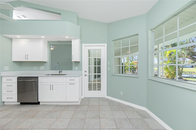 217 Rotonda Cir, Rotonda West, FL 33947 - kitchen featuring stainless steel dishwasher, light countertops, a ceiling fan, white cabinets, and recessed lighting