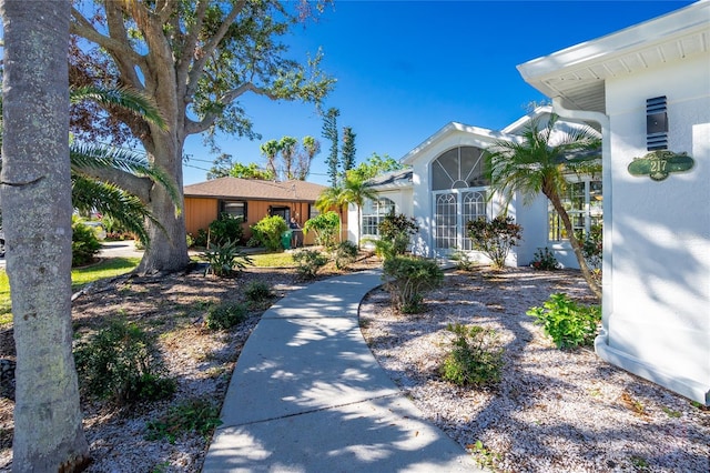 217 Rotonda Cir, Rotonda West, FL 33947 - view of front of house with stucco siding