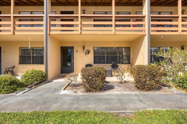 entrance to property featuring a balcony