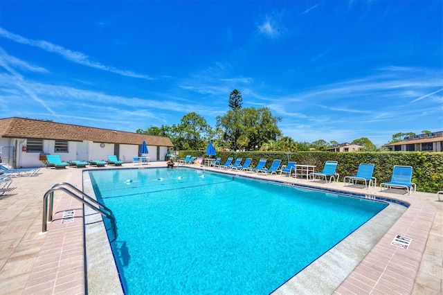 view of swimming pool featuring a patio area