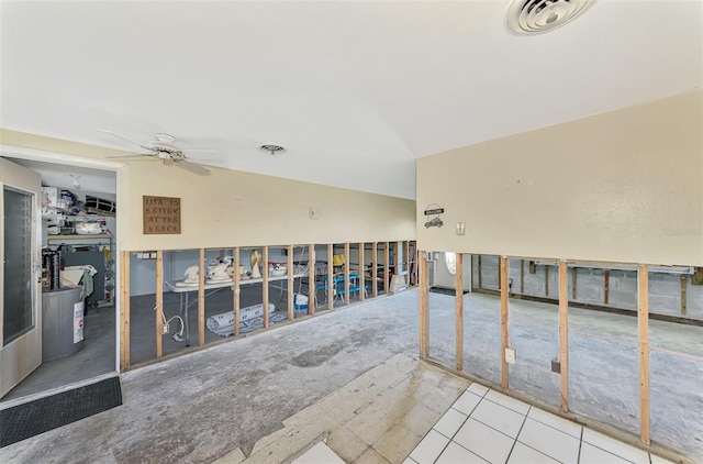 tiled spare room with ceiling fan