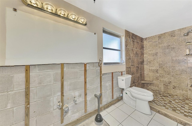 bathroom featuring toilet and tile patterned flooring