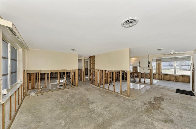 105 Crestview Dr, Englewood, FL 34223 - spare room with ceiling fan and unfinished concrete flooring