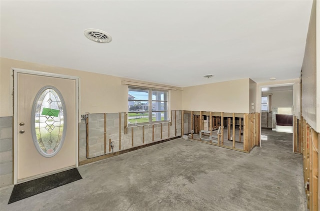 foyer featuring concrete flooring