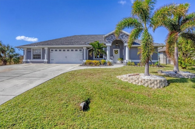 view of front of property with a front lawn and a garage