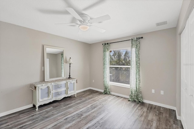 unfurnished room featuring wood-type flooring and ceiling fan