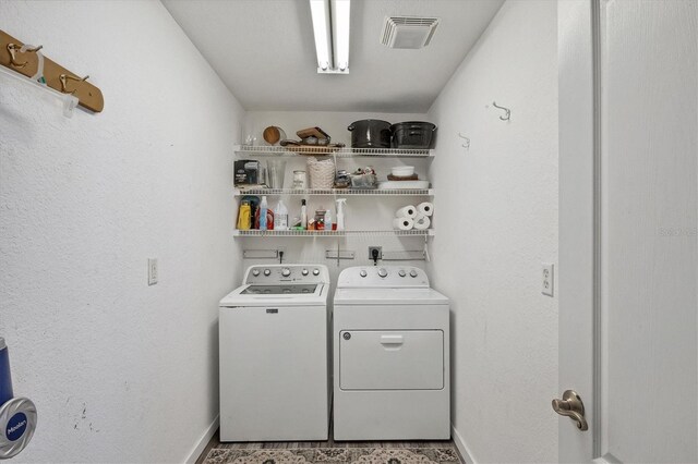 10083 Kansas City St, Port Charlotte, FL 33981 - laundry room with washer and clothes dryer and baseboards