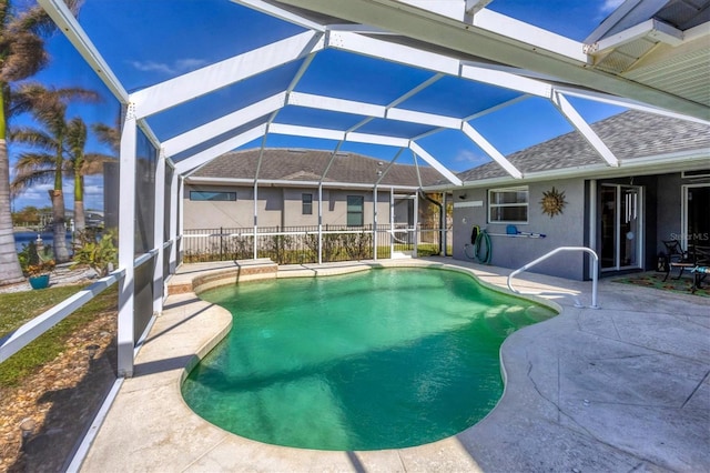 view of pool with a lanai and a patio area