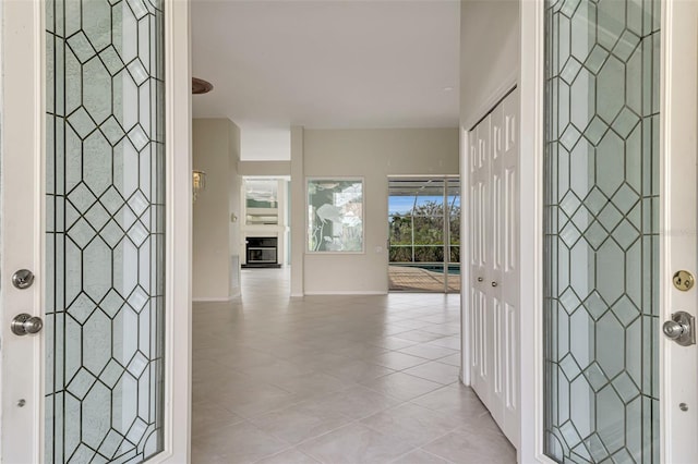 entrance foyer with light tile patterned floors