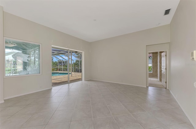 spare room featuring light tile patterned floors