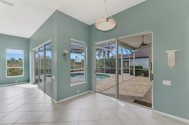 doorway to outside featuring light tile patterned floors and ceiling fan