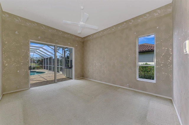 empty room with carpet and ceiling fan