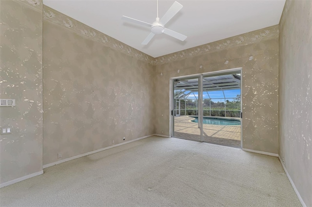 empty room with ceiling fan and carpet flooring