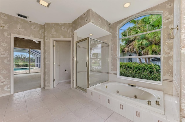 bathroom featuring tile patterned floors and independent shower and bath