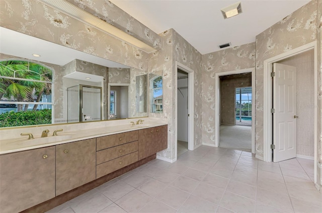 bathroom with vanity, tile patterned flooring, and a shower with shower door