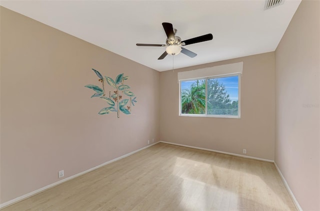 spare room with ceiling fan and light hardwood / wood-style flooring