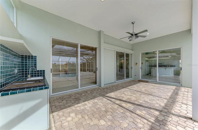 view of patio with ceiling fan