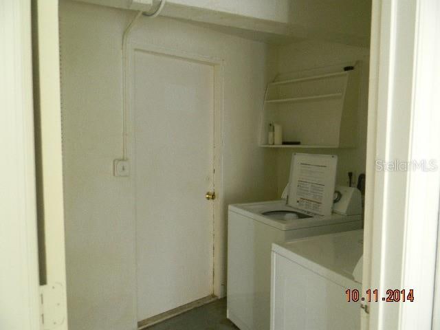 clothes washing area featuring washer and clothes dryer