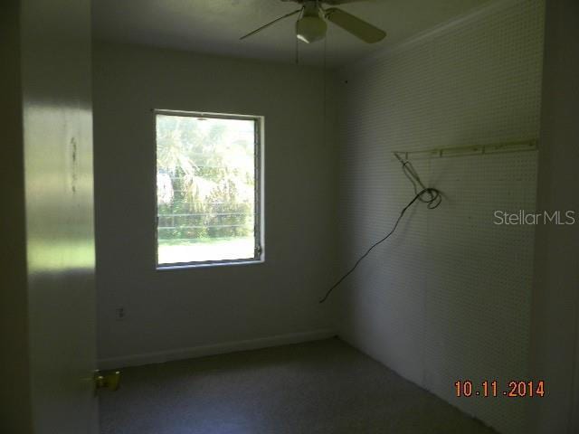 spare room with ceiling fan