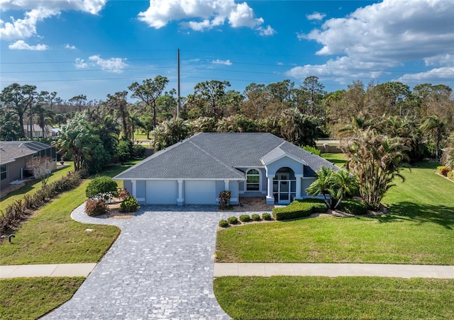 single story home with a front lawn and a garage