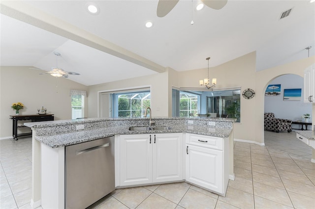 kitchen with dishwasher, sink, light stone countertops, vaulted ceiling, and white cabinetry