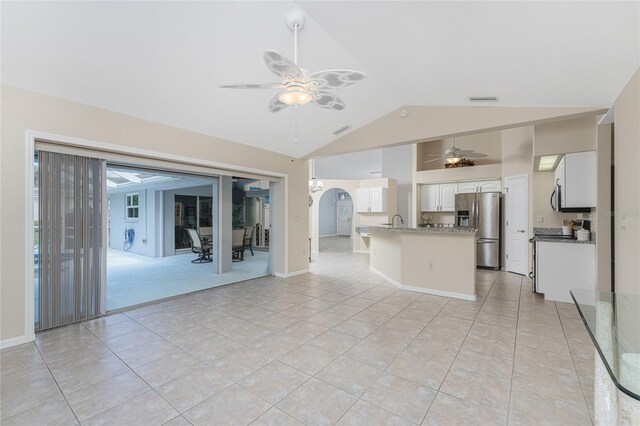 110 Abercrombie Ave, Englewood, FL 34223 - unfurnished living room featuring a ceiling fan, light tile patterned floors, a sink, and high vaulted ceiling