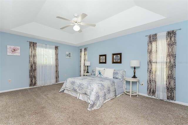 110 Abercrombie Ave, Englewood, FL 34223 - bedroom featuring a raised ceiling, carpet floors, ceiling fan, and baseboards
