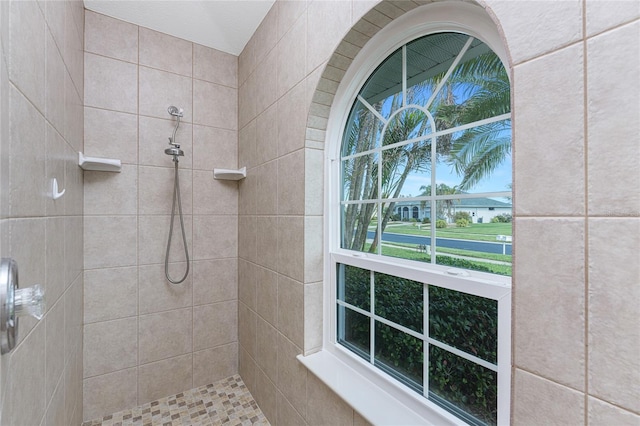 bathroom with a tile shower