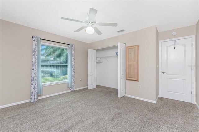 110 Abercrombie Ave, Englewood, FL 34223 - unfurnished bedroom with carpet flooring, baseboards, a closet, and ceiling fan