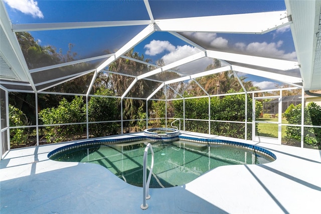 view of swimming pool featuring a patio, a lanai, and an in ground hot tub