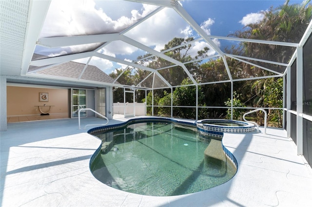 view of swimming pool featuring an in ground hot tub, a patio, and glass enclosure